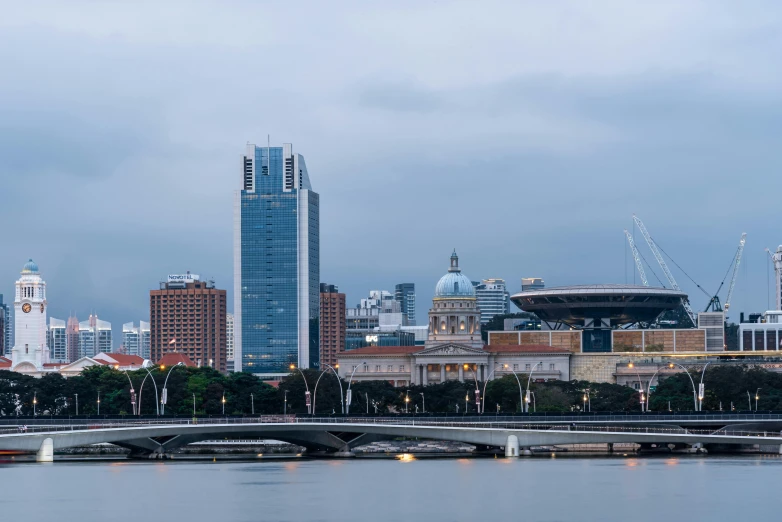 a bridge over a body of water with a city in the background, by Joseph Severn, pexels contest winner, national gallery, skyline showing, 200mm wide shot, building along a river
