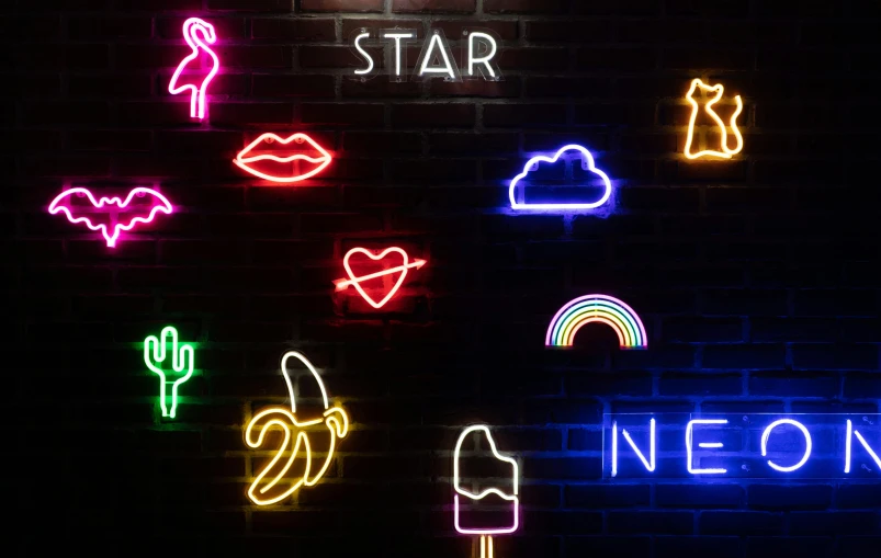 a bunch of neon signs on a brick wall, trending on pexels, interactive art, star sky, profile image, instagram art, netflix neon logo concept art
