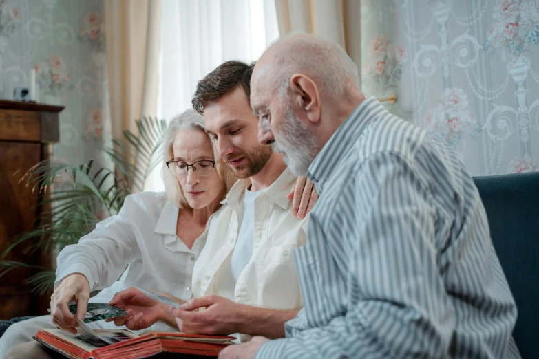 a man and woman sitting on a couch looking at a magazine, a screenshot, pexels contest winner, two old people, group sit at table, 30 year old man, profile image