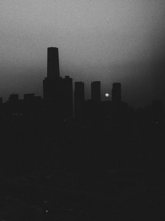 a black and white photo of a city at night, a black and white photo, by Attila Meszlenyi, brutalism, sun set, shanghai, the moon is big an in the city, night. by greg rutkowski