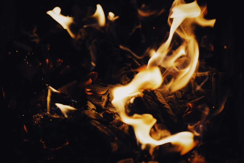 a close up of a fire in the dark, an album cover, pexels contest winner, grainy, avatar image, ignant, unsplash 4k