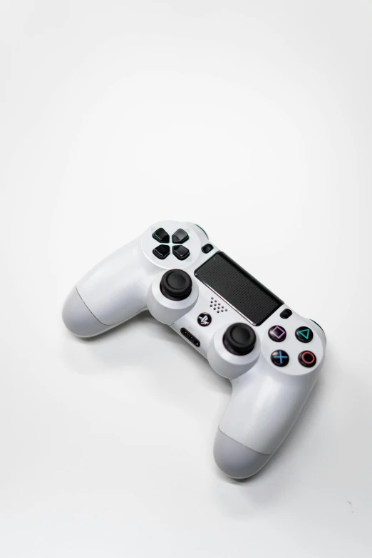 a close up of a video game controller, a picture, by Carey Morris, minimalism, plain white background, playstation 4, square enix, full shot photograph