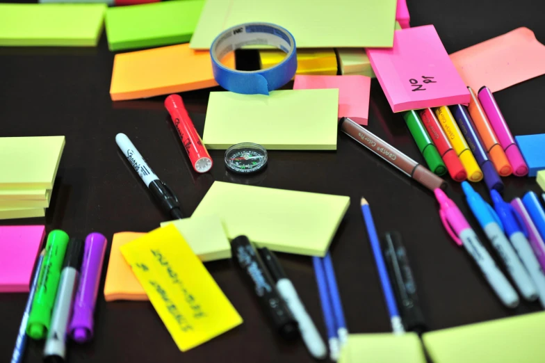 a bunch of sticky notes sitting on top of a table, with a bunch of stuff, coloured marker, thumbnail, high quality product image”