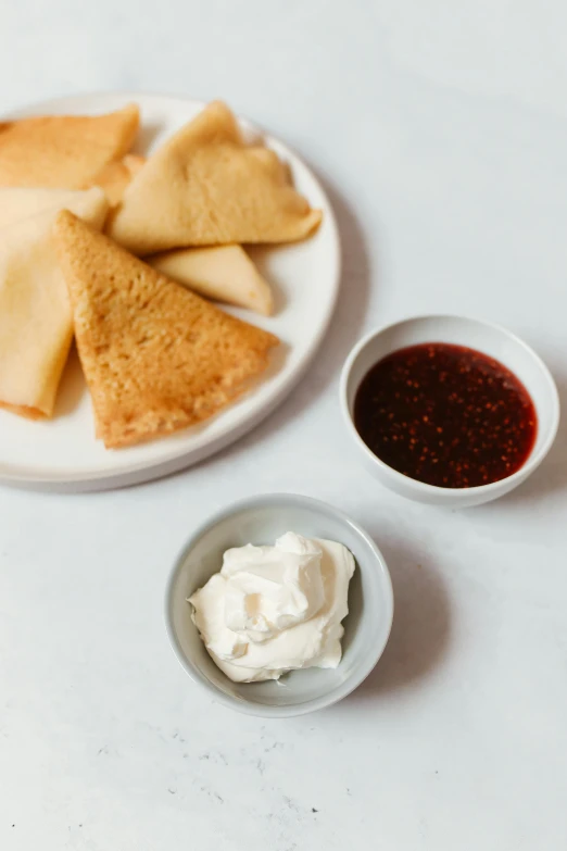 a plate that has some food on it, inspired by Géza Dósa, whipped cream on top, triangles, russian, toast