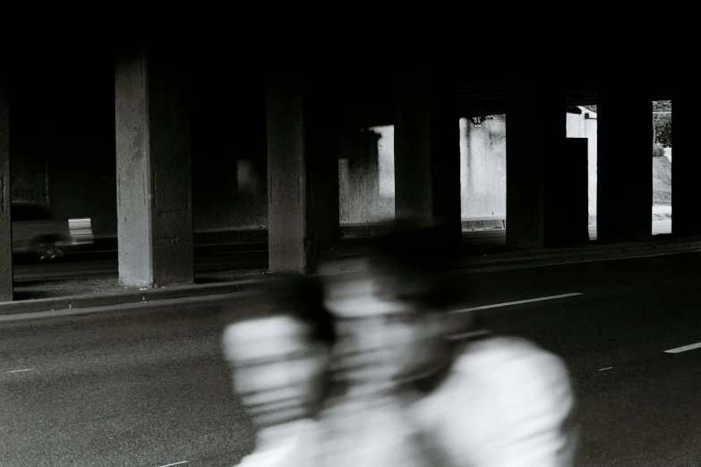 a couple of people riding on the back of a motorcycle, a black and white photo, inspired by Garry Winogrand, unsplash, ghosts, overpass, ilustration, portait image