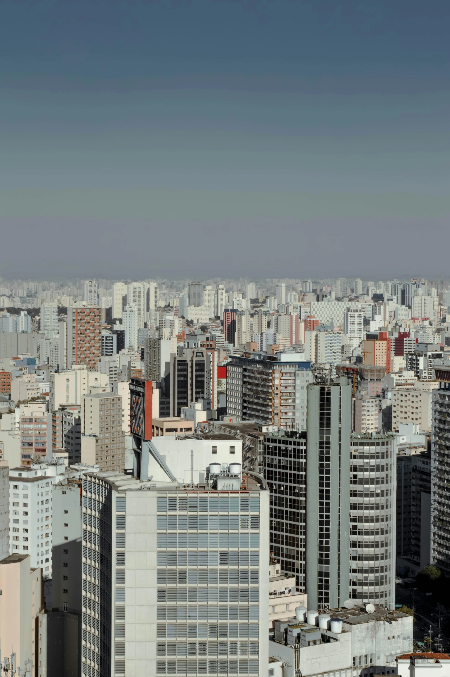 a view of a city from the top of a building, inspired by Antônio Parreiras, hyperrealism, 8k render”, 4k image”, gigapixel, wide open city ”