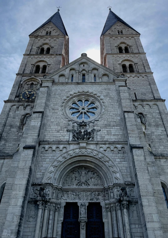 a large cathedral with a clock on the front of it, romanesque, taken in 2022, front view dramatic, montreal, 2 5 6 x 2 5 6 pixels