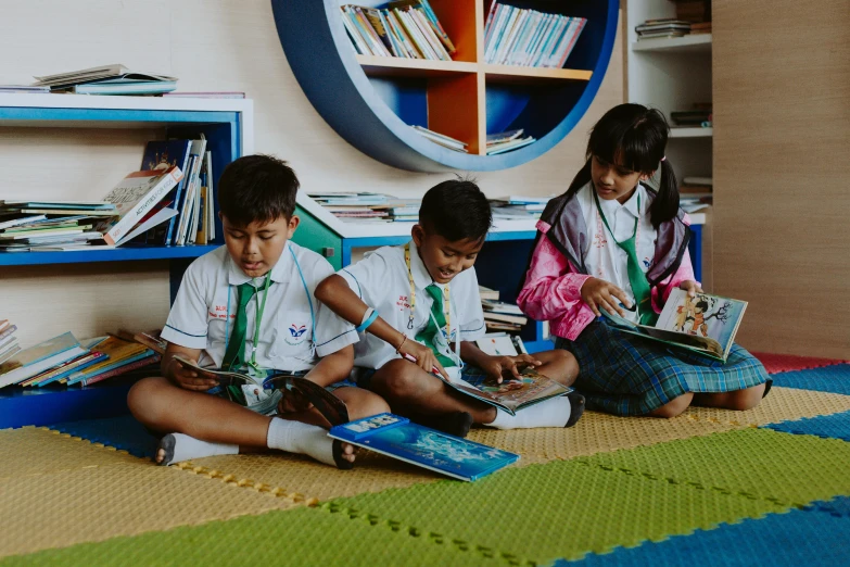 a group of children sitting on the floor reading books, pexels contest winner, ashcan school, thailand, avatar image