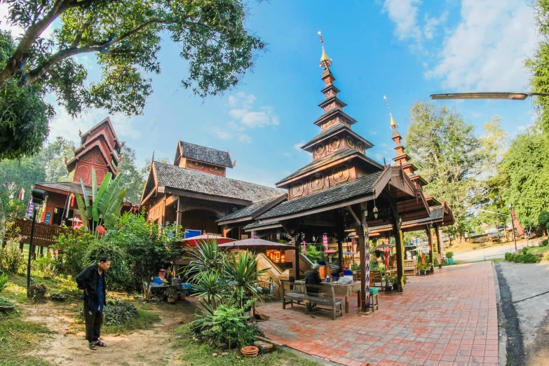 a person standing in front of a building, sumatraism, church in the wood, paradise garden massage, profile image