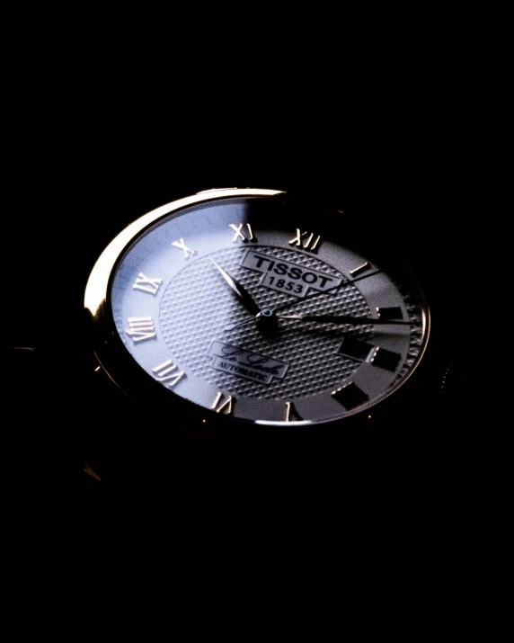 a close up of a clock in the dark, thumbnail, strogg, gold watch, directional sunlight skewed shot