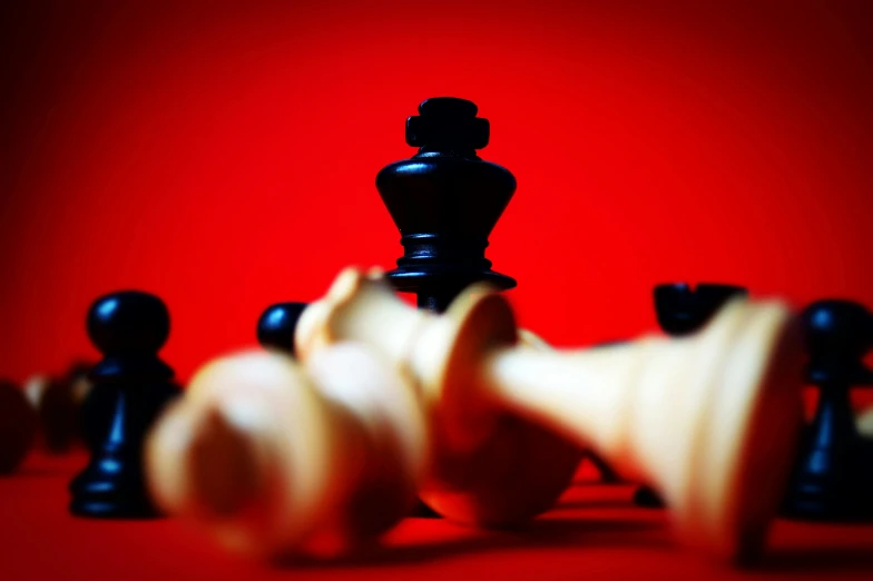 a group of black and white chess pieces, unsplash, synthetism, on a red background, ((sharp focus)), crowned, thumbnail