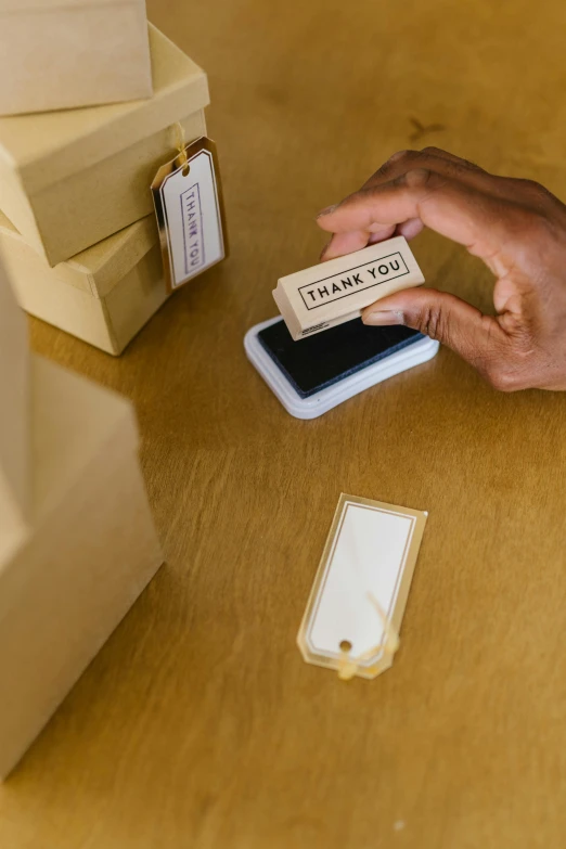 a person sitting at a table with a cell phone, packaging, rubber stamp, thumbnail, transparent