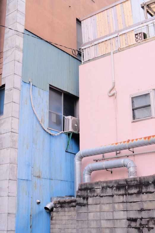 a man riding a skateboard up the side of a building, shin hanga, blue and pink color scheme, diaper disposal factory, chimneys on buildings, air conditioner