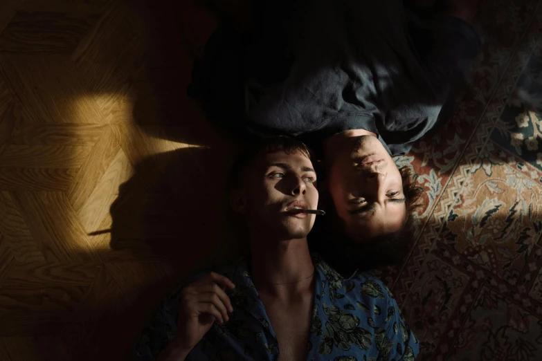 a couple of people laying on top of a bed, a portrait, by Elsa Bleda, pexels contest winner, hyperrealism, light over boy, maxim sukharev, cinematic movie still, lgbtq