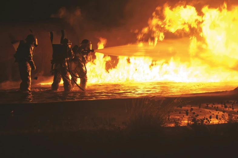 a group of people standing in front of a fire, during the night, profile image, firefighter, foam