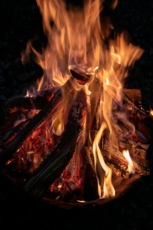 a close up of a fire in the dark, by Jan Rustem, summer setting, celebrating, warm wood, fire and ice