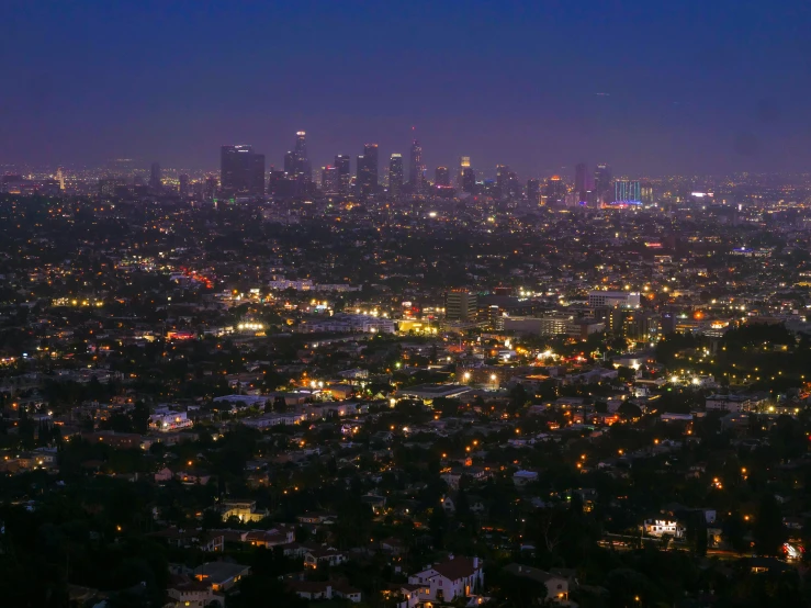 a view of a city at night from the top of a hill, inspired by L. A. Ring, unsplash contest winner, mulholland drive, photo 4k, ☁🌪🌙👩🏾, low detail