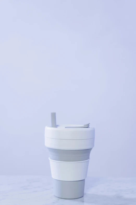 a close up of a cup on a table, product image, silicone skin, folded, high quality product image”