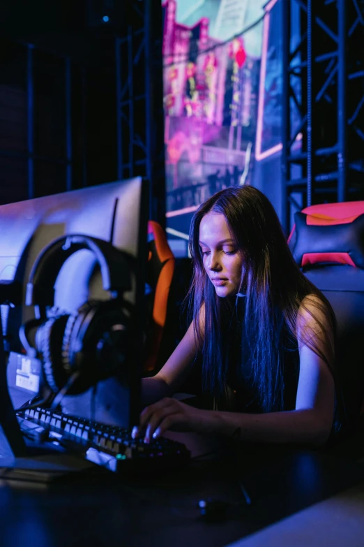 a woman sitting in front of a laptop computer, by Adam Marczyński, e-sport style, server in the middle, 1 6 years old, profile picture 1024px