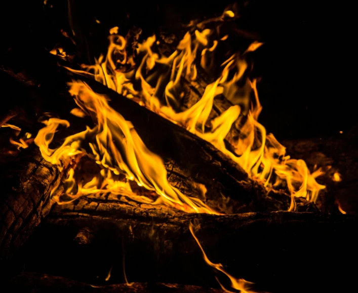 a close up of a fire in the dark, an album cover, pexels, campfire background, avatar image, stacked image, profile photo