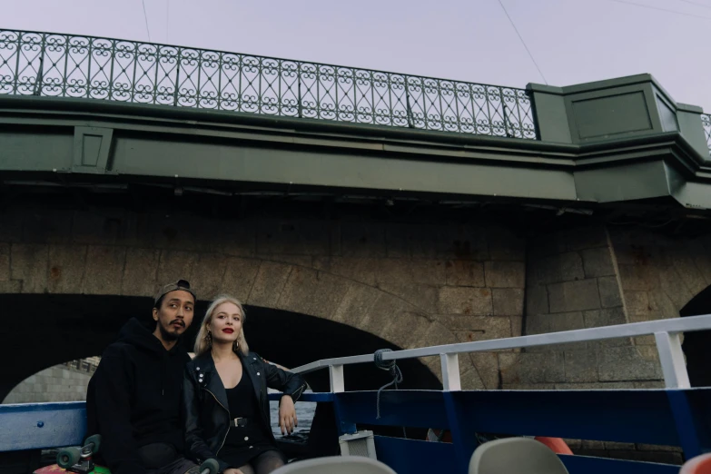 a man and a woman sitting on a boat, a portrait, unsplash, overpass, spooky photo, instagram post, epk