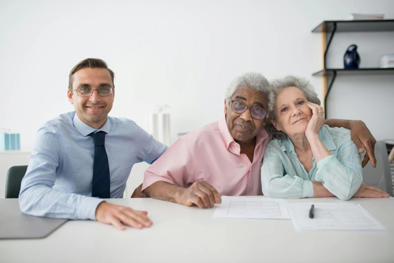 a couple of people that are sitting at a table, wise old man, professional picture, selling insurance, blind brown man