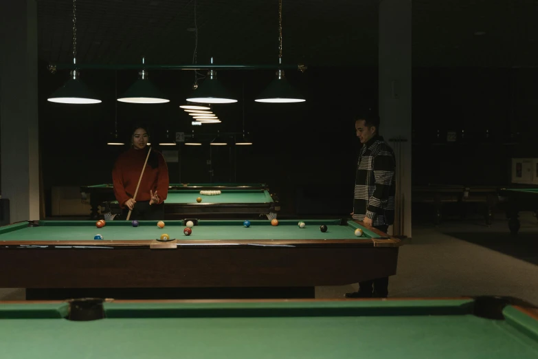 a couple of men playing a game of pool, by Elsa Bleda, purism, 4 k cinematic still, alessio albi, 7 0 s photo