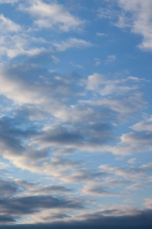 a person flying a kite on a cloudy day, by Linda Sutton, minimalism, layered stratocumulus clouds, dawn, subtle blue, 15081959 21121991 01012000 4k