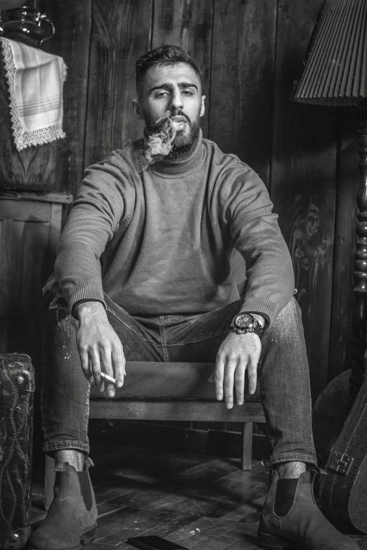 a black and white photo of a man sitting in a chair, inspired by Jack Smith, pexels contest winner, renaissance, lumberjack, holding cigar, modelling, promotional image