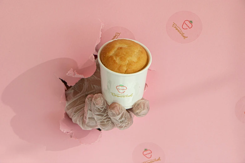 a cup of coffee sitting on top of a pink surface, bakery, detailed product image, chambliss giobbi, covered!