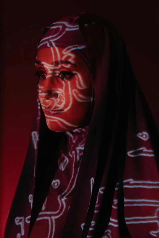 a woman with white paint on her face, an album cover, by Maryam Hashemi, pexels contest winner, afrofuturism, red glowing veins, burka, still from film, ((portrait))