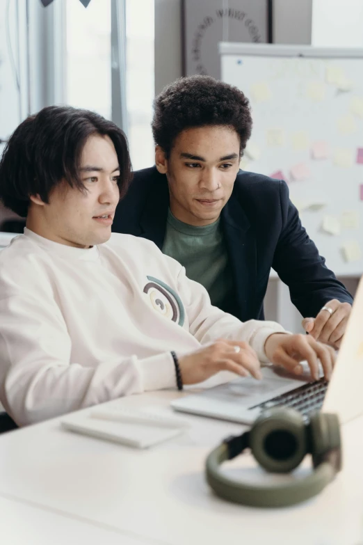 two men sitting in front of a laptop computer, trending on pexels, renaissance, ethnicity : japanese, studious, gif, engineer