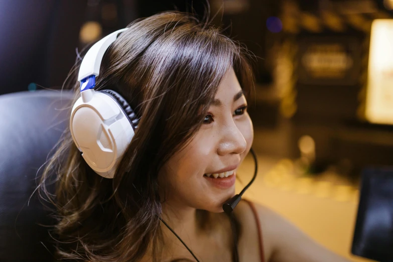 a woman sitting in front of a laptop wearing headphones, inspired by Leng Mei, renaissance, closeup headshot, gaming headset, profile image, background image