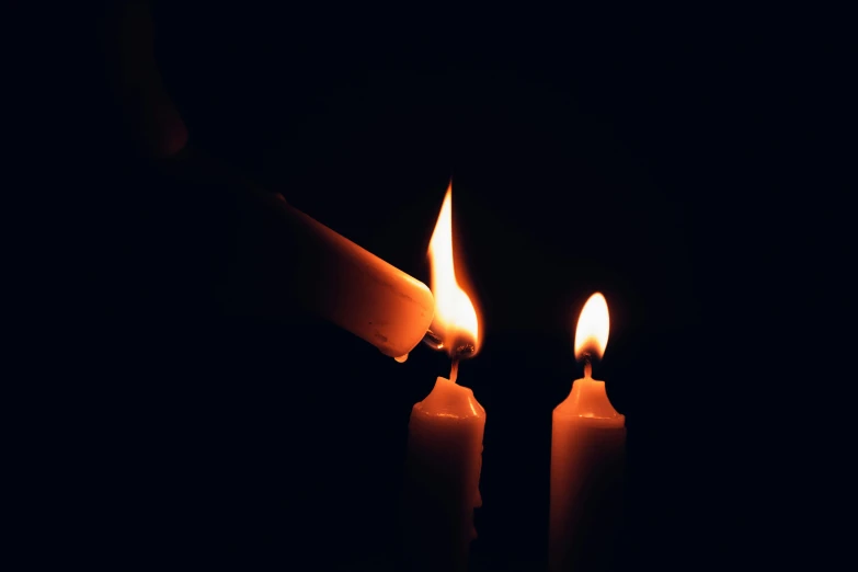 a close up of two lit candles in the dark, an album cover, profile image, profile picture, ignant, tragedy