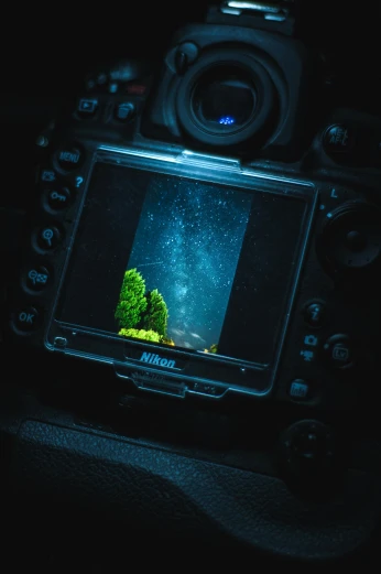 a camera that is sitting in the dark, a hologram, inspired by Filip Hodas, unsplash contest winner, underwater landscape, lcd screen, holding nikon camera, inside of a car