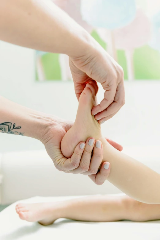 a woman getting a foot massage in a room, lynn skordal, close-up of thin soft hand, compression, ilustration