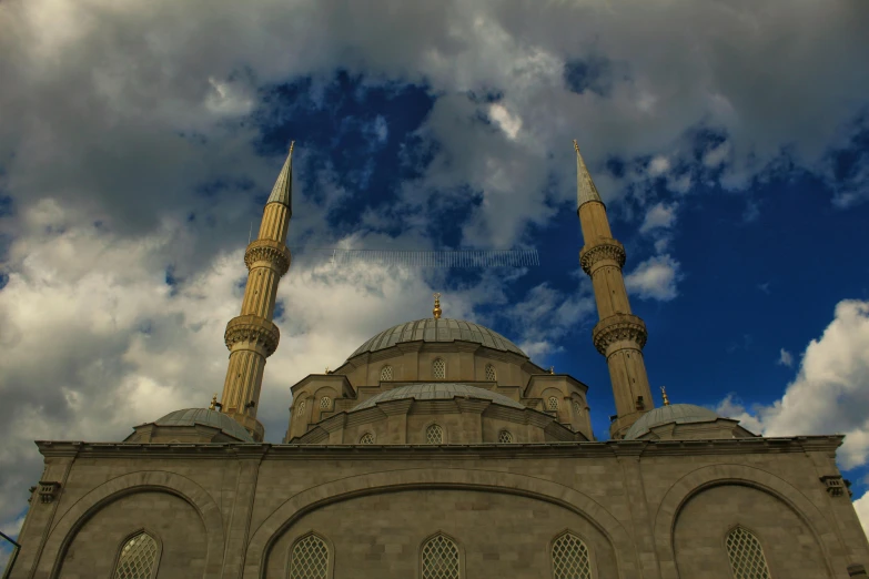 a large building with a blue sky in the background, by Ismail Acar, pexels contest winner, hurufiyya, minarets, 2 5 6 x 2 5 6, grey cloudy skies, paisley