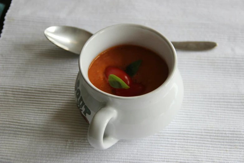 a close up of a cup of soup on a table, tomato, bespoke, square, handmade