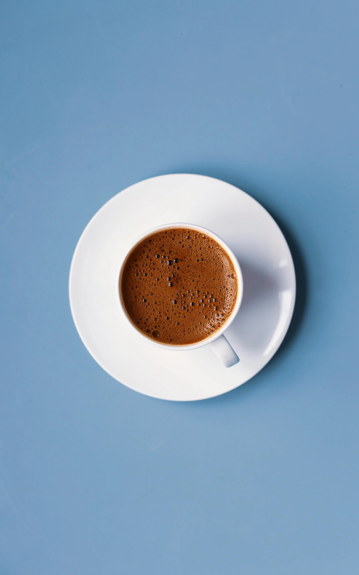 a cup of coffee sitting on top of a saucer, with a blue background, turkey, multiple stories, thumbnail