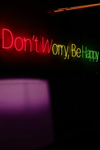 a neon sign that says don't worry be happy, an album cover, by Bruce Munro, pixabay, graffiti, in a nightclub, teamlab, photograph credit: ap, 2 5 6 x 2 5 6 pixels
