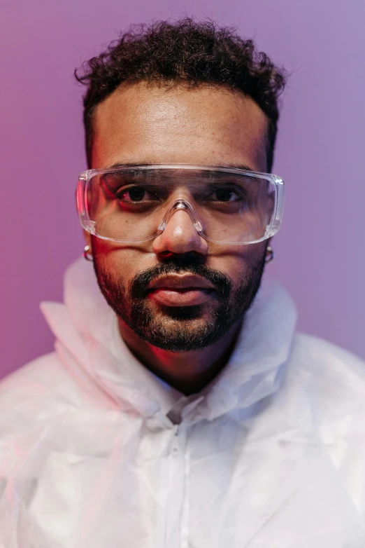 a man in a white jacket and goggles, an album cover, inspired by Ismail Gulgee, pexels contest winner, lgbtq, diverse medical cybersuits, headshot photo, artist wearing overalls