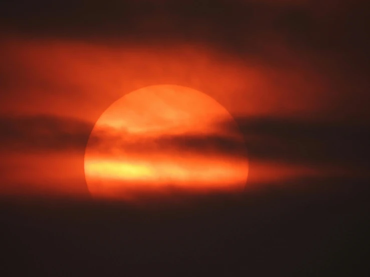 a plane is flying in front of the sun, by Ian Fairweather, romanticism, red illuminating fog, closeup photograph, orange, uncropped