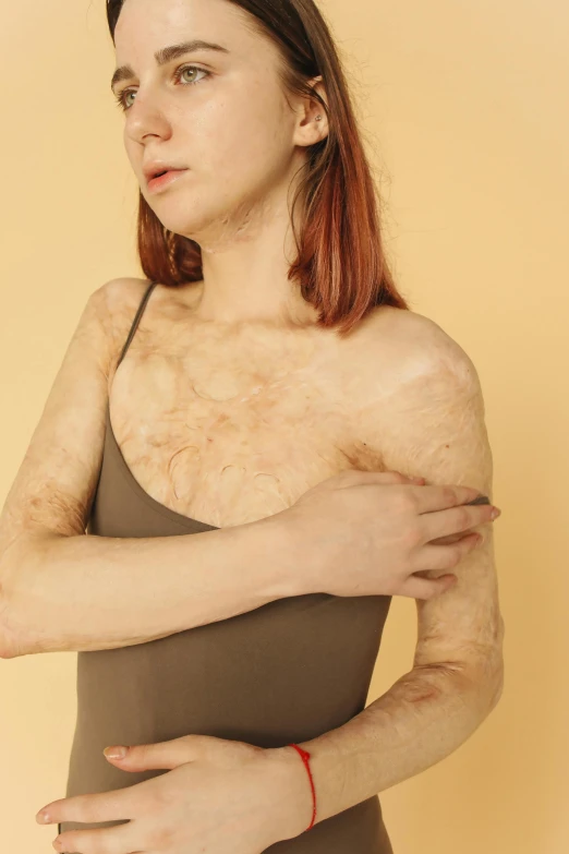 a close up of a person wearing a bodysuit, an album cover, inspired by Elsa Bleda, trending on pexels, hairy arms, deteriorated, cinnamon skin color, full body image