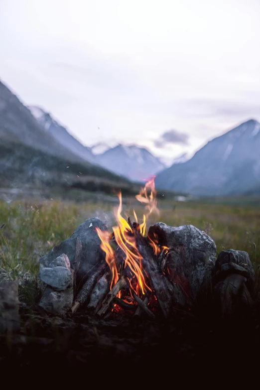 a campfire with mountains in the background, pexels contest winner, land art, nordic, cozy aesthetic, profile picture, mongolia