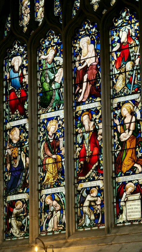 a large stained glass window in a church, inspired by Edward Burne-Jones, pexels, mary anning, hi-res, multi - coloured, panels