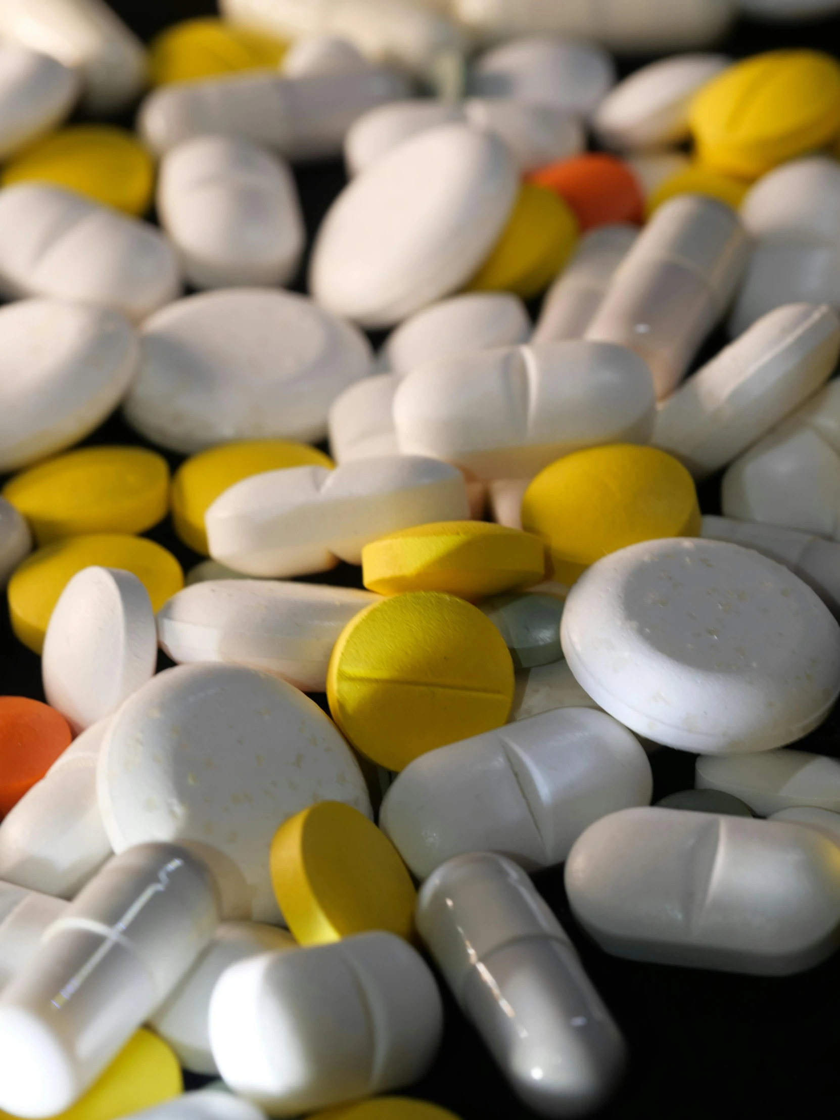 a pile of pills sitting on top of a table, by Matt Cavotta, pexels, antipodeans, white and yellow scheme, multiple stories, 15081959 21121991 01012000 4k, various colors