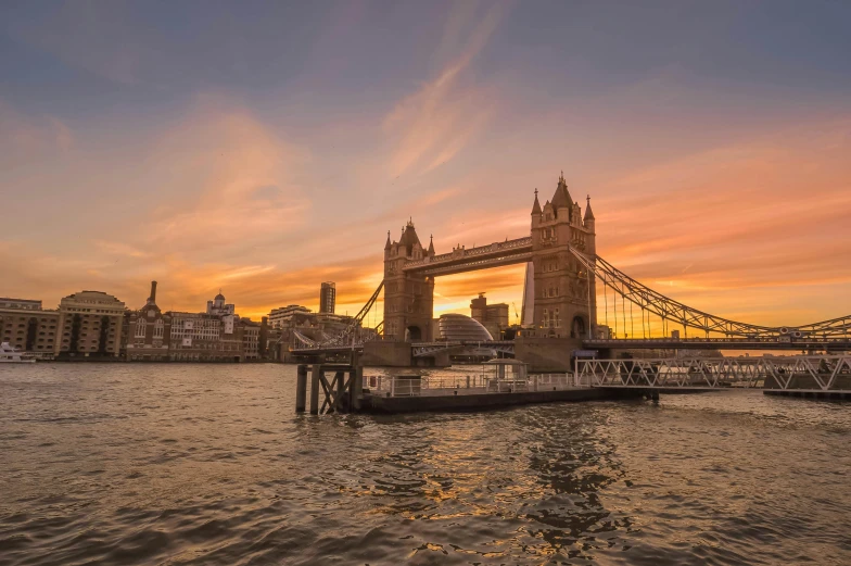 a bridge over a body of water at sunset, pexels contest winner, tower bridge, thumbnail, golden hour”, panoramic photography