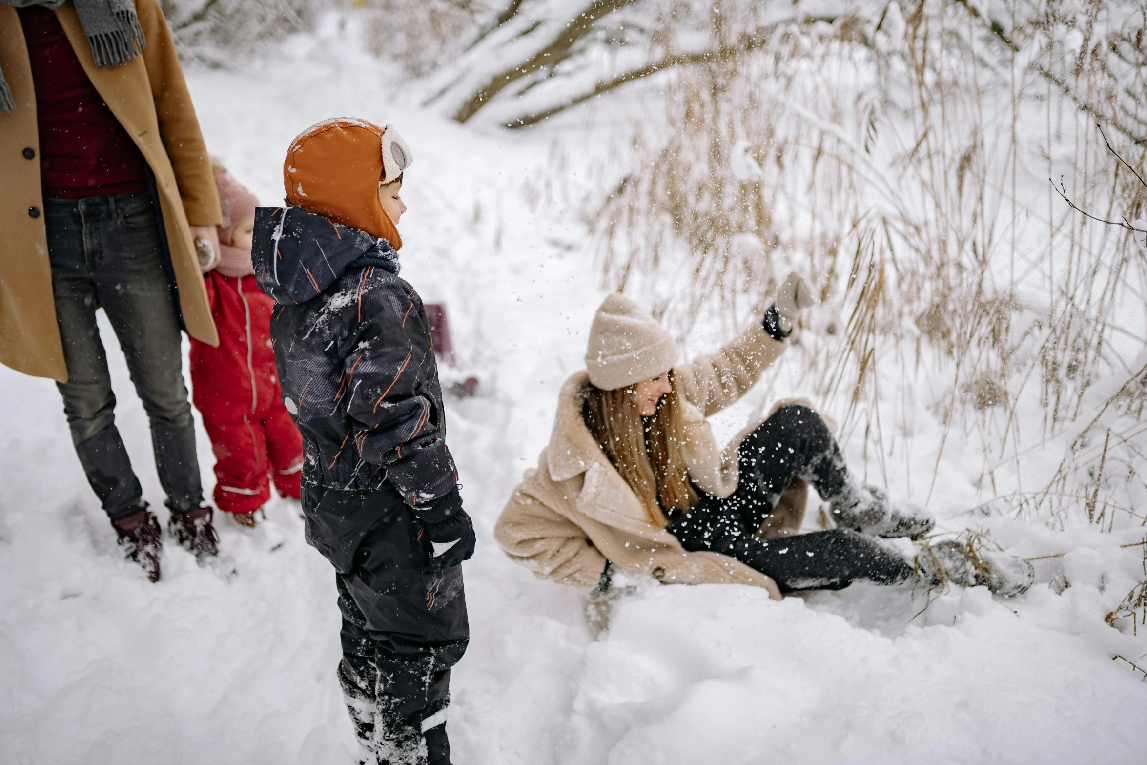 a woman and a child playing in the snow, pexels contest winner, avatar image, hiking clothes, cardboard, full of details