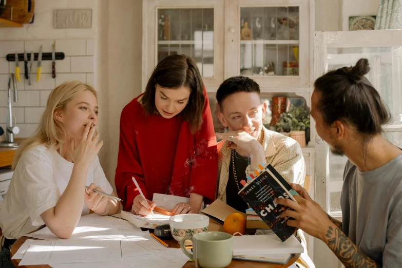 a group of people sitting around a kitchen table, studious, millennial vibes, cigarrette boxes at the table, profile image