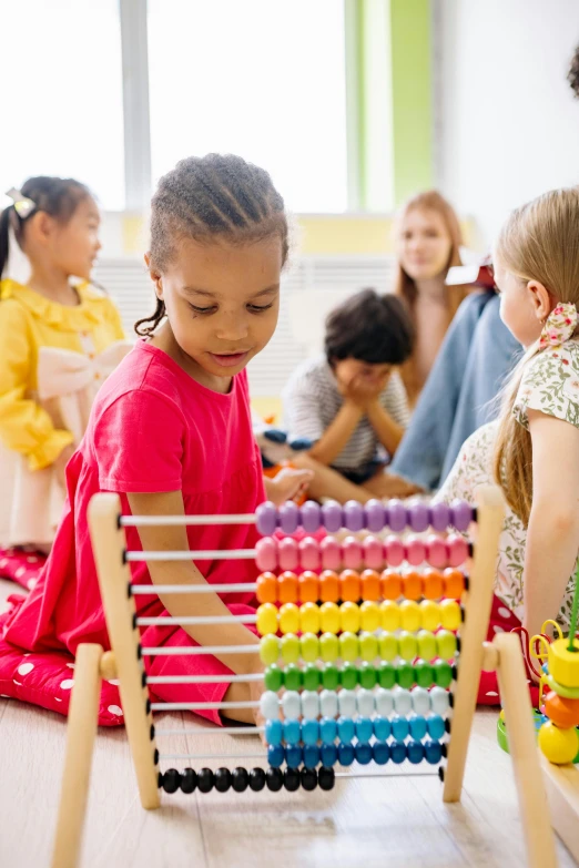 a group of children playing with an aba aba aba aba aba aba aba aba aba aba aba, by Julian Allen, pexels contest winner, mathematical, in a classroom, panoramic view of girl, various colors